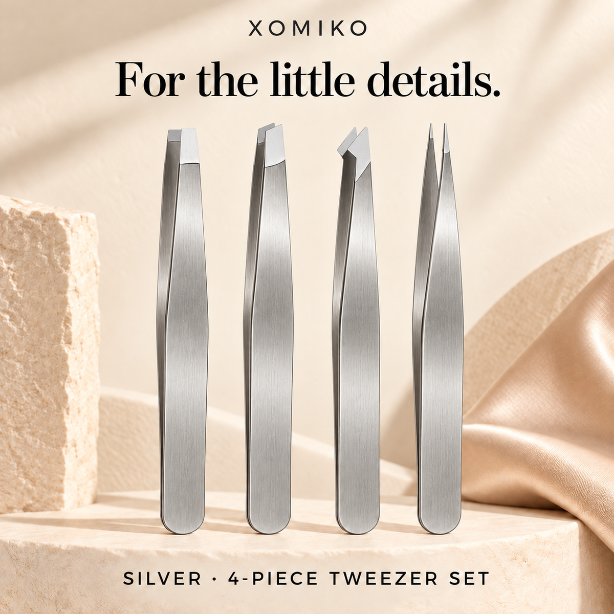 Xomiko four-piece stainless steel tweezer set for eyebrows and stray hairs